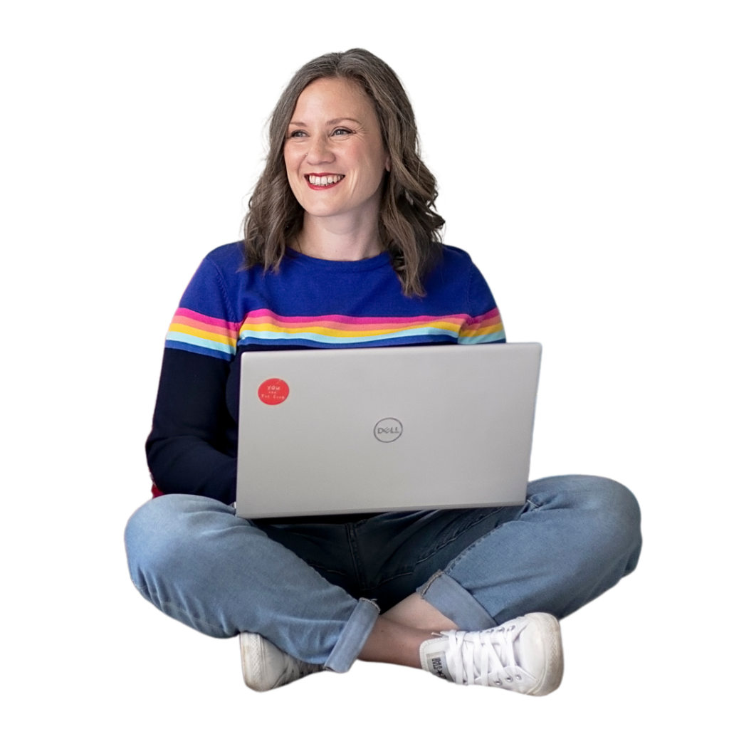 Photo of Virtual Assistant Hannah sitting cross legged with a laptop on her lap. She gives off an impression of being in control and capable in order to help you manage and grow your business