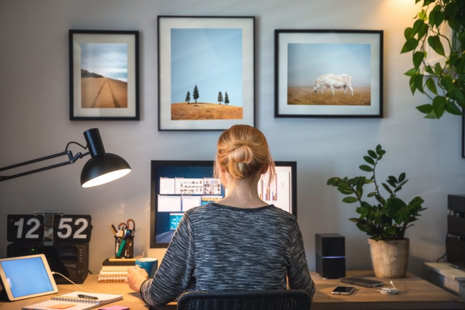 Image of a woman at a computer taken from behind. Lots of tabs open on her desktop. The email tech is overwhelming